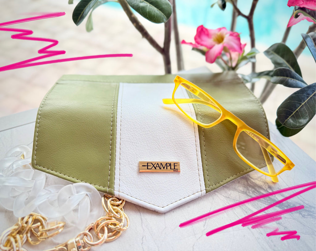 Green and white Diamond Lifter Long Wallet with yellow eye glasses and pink flowers.